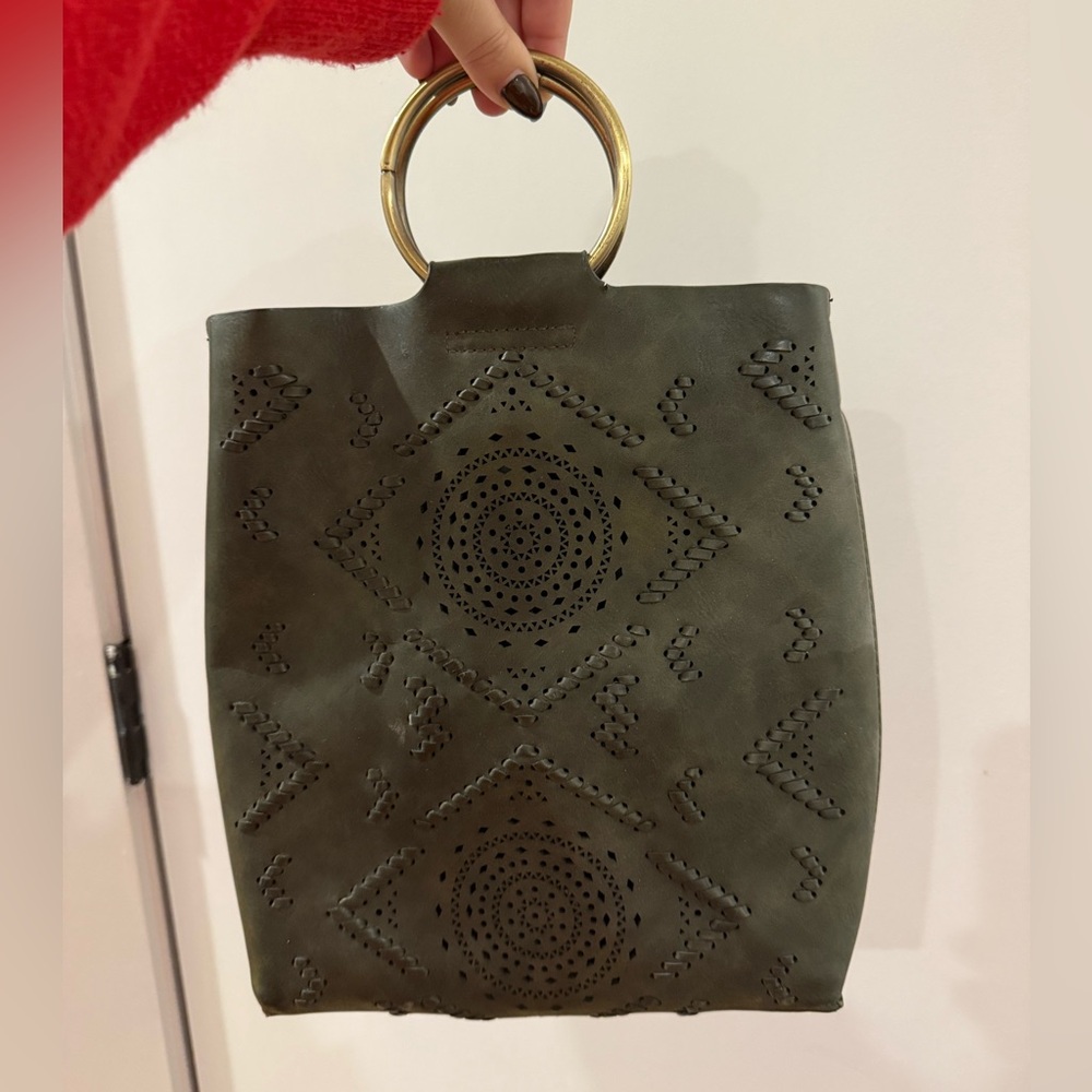 Green suede bag with gold ring handle